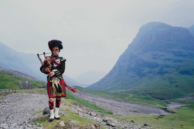 A true Scottish landscape with bagpipes and glen